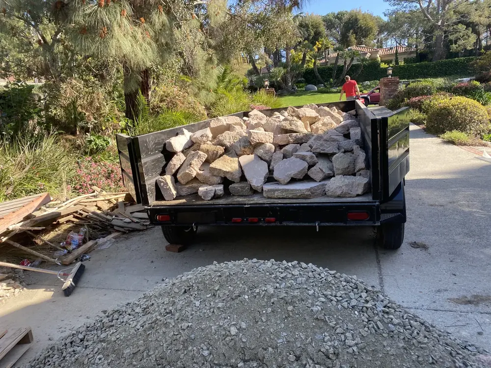 Dump trailer loaded with rock and construction debris