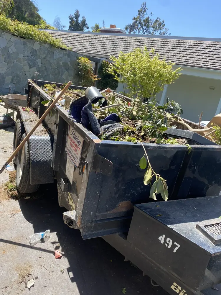 Dump trailer loaded during a cleanout