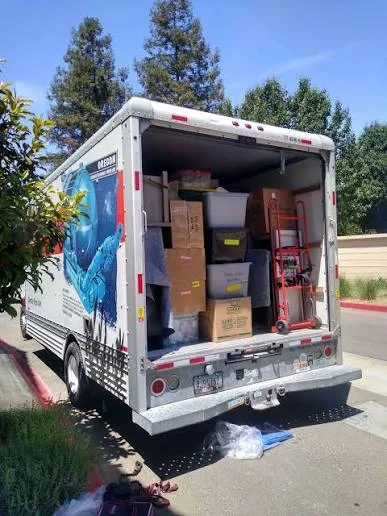 Packed customer-provided U-Haul truck